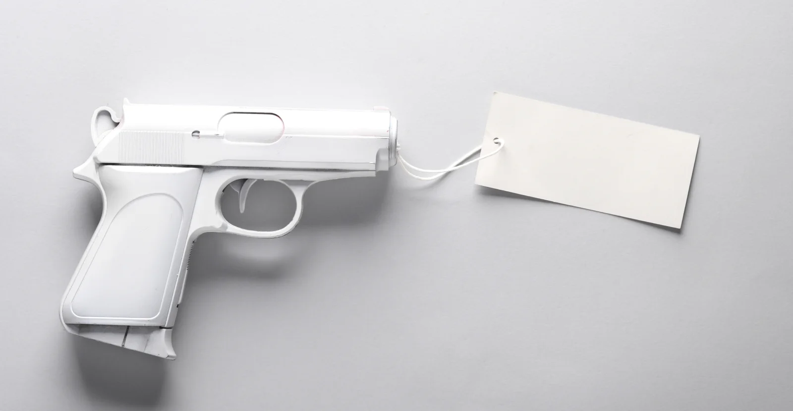 white gun with price tag