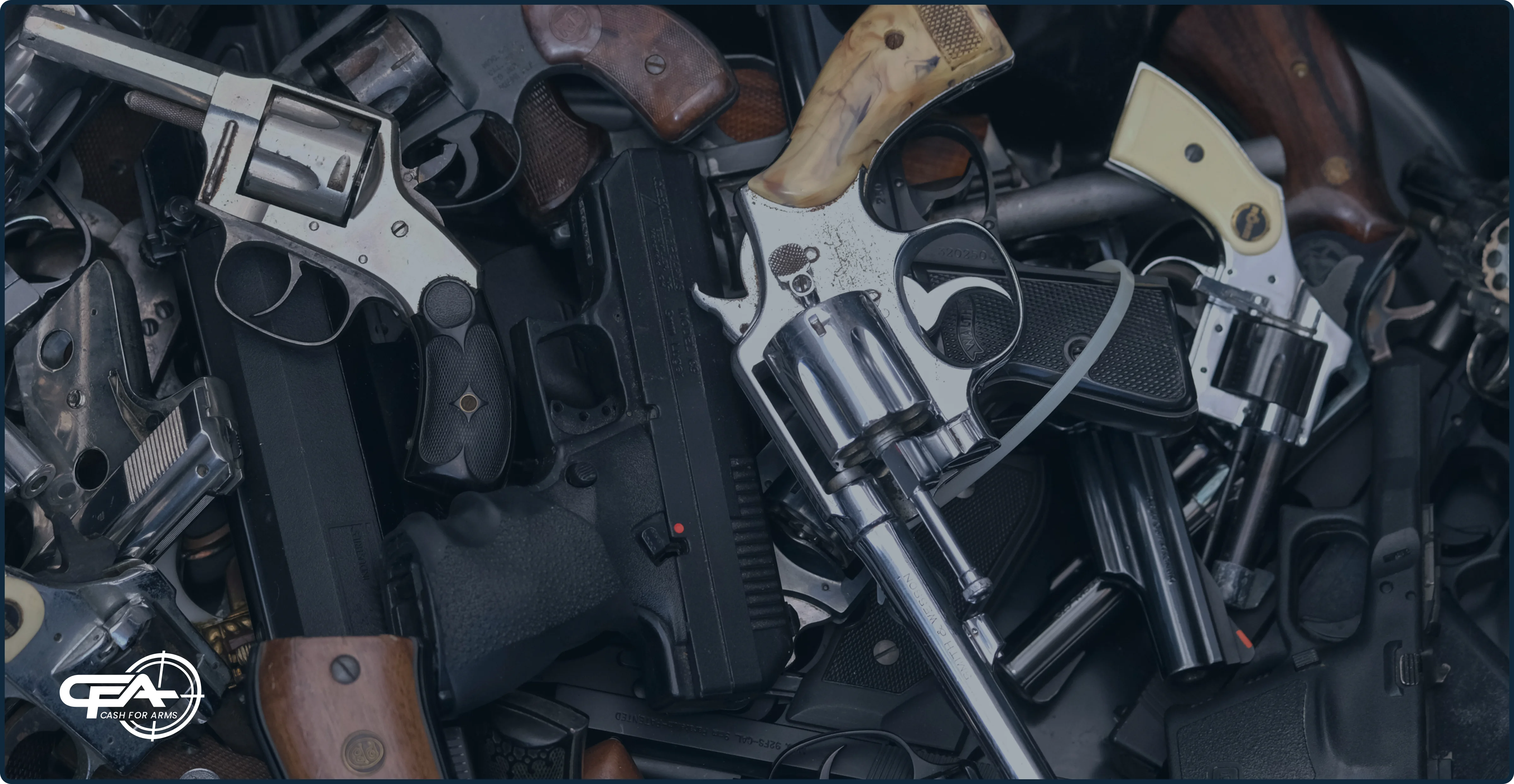 handguns in a pile