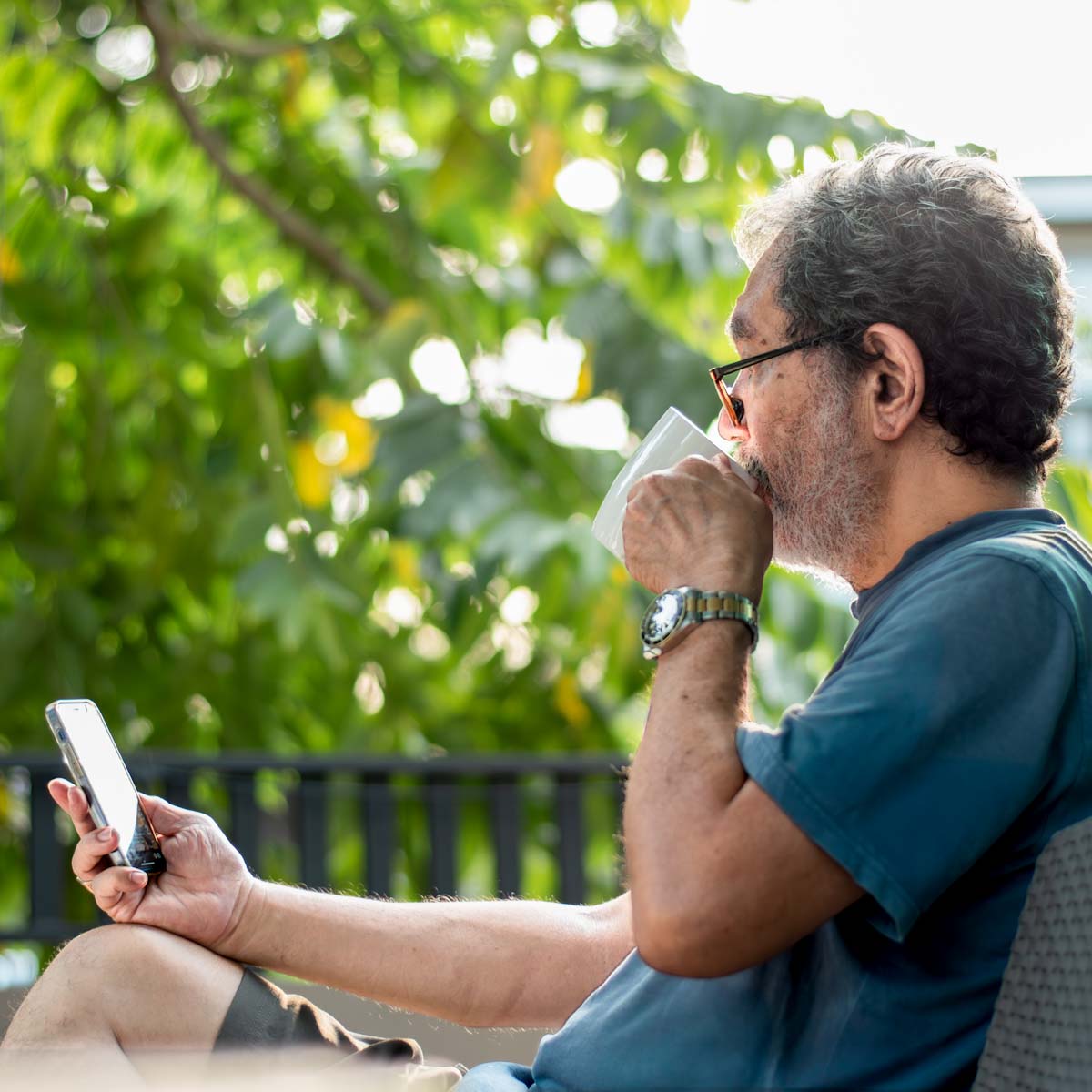 Middle age man on phone outside
