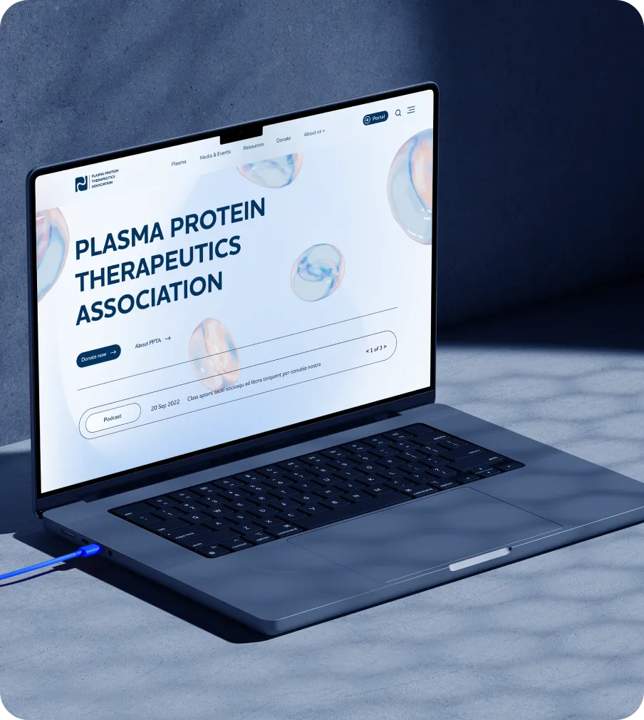 MacBook Pro with the homepage open, placed on a dark blue flat surface.