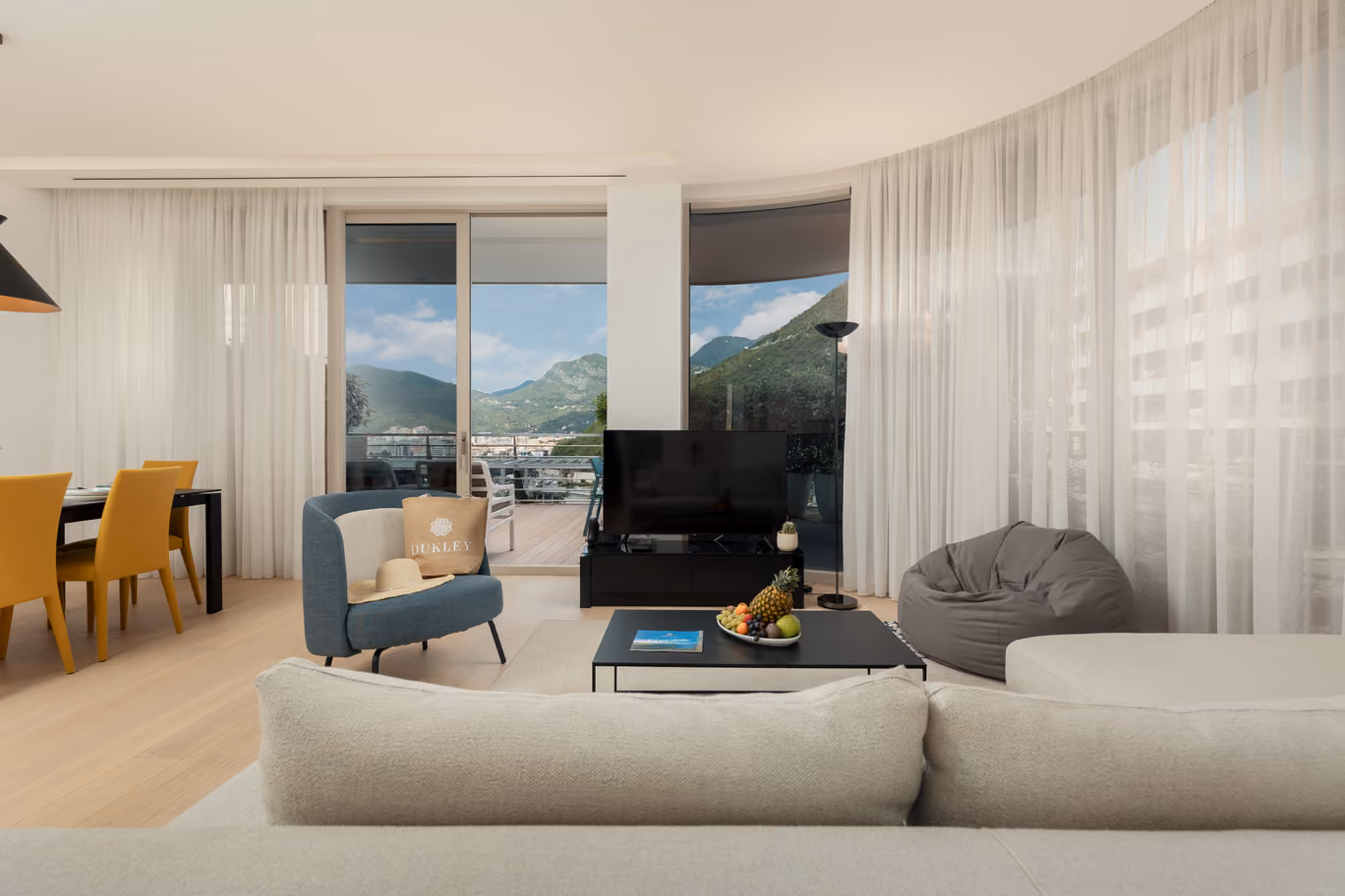 Spacious and airy two-bedroom apartment with a view of green gardens at Dukley Hotel in Budva.