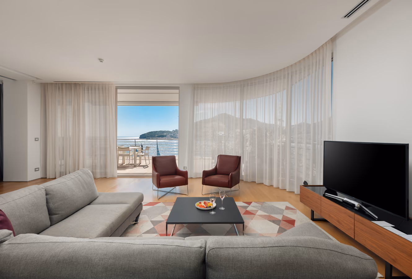 Two-store three-bedroom penthouse featuring open deck terrace with hot tub and view of Adriatic, big living space with kitchen and master bedrooms.