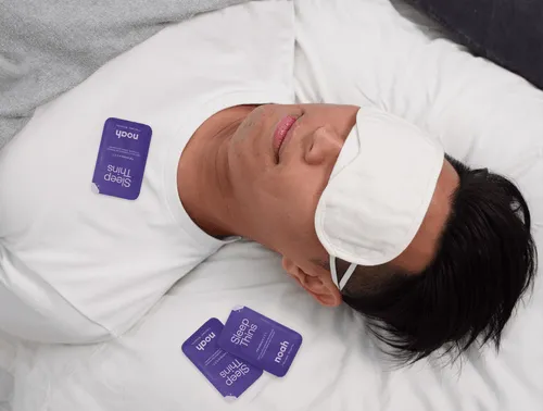 A sleeping Singaporean man wearing an sleep mask