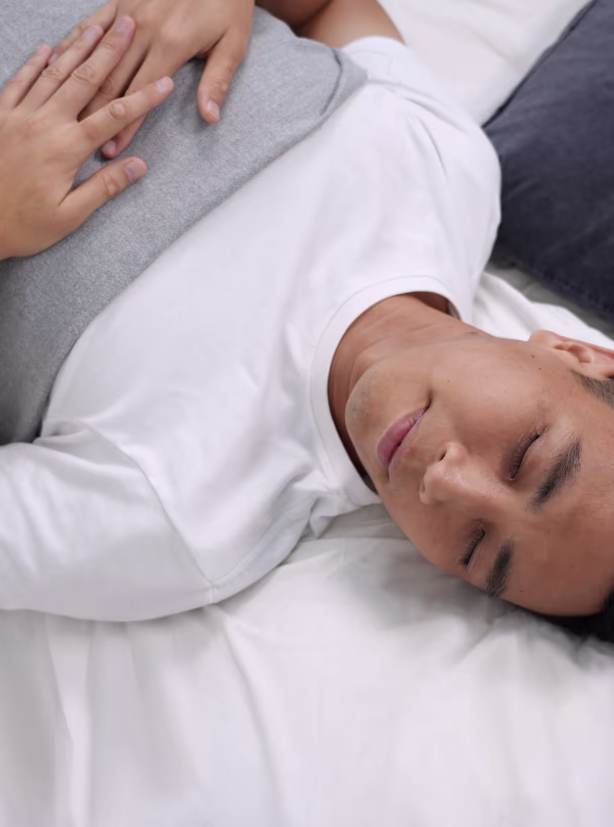 A young Singaporean male sleeping