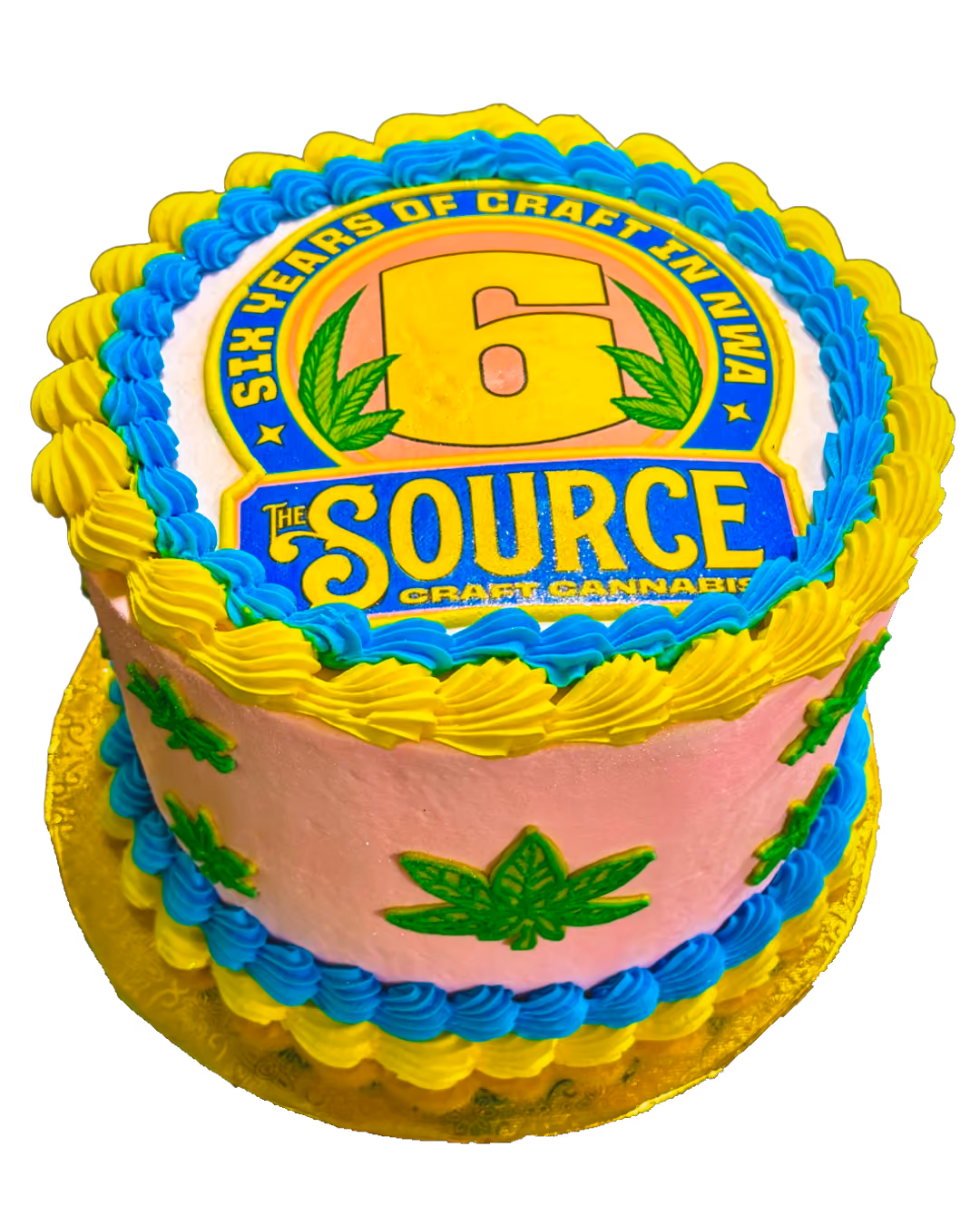 The Source 6th anniversary celebration cake with blue and yellow frosting featuring Six Years of Craft in NWA design.