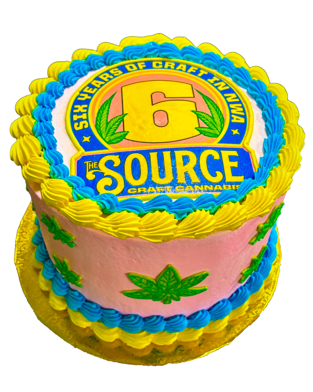 The Source 6th anniversary celebration cake with blue and yellow frosting featuring Six Years of Craft in NWA design.