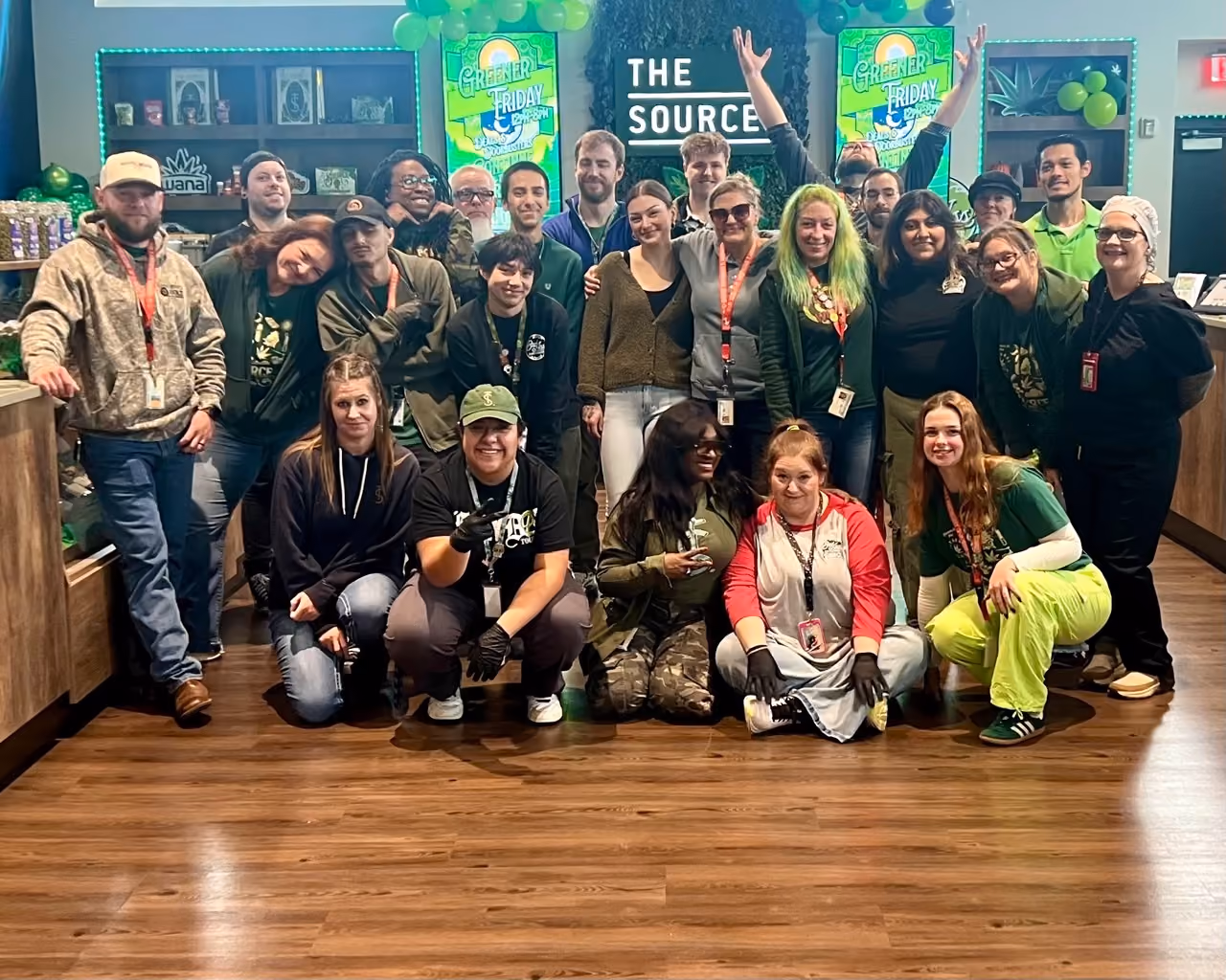 The Source dispensary full team group photo inside Rogers, Arkansas location.