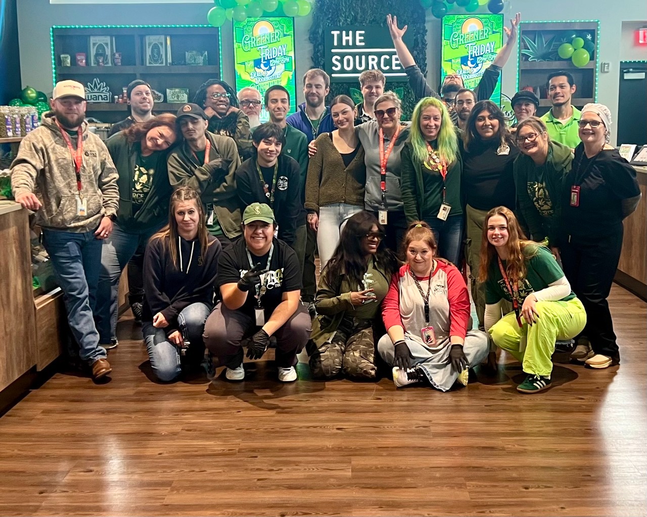 The Source dispensary full team group photo inside Rogers, Arkansas location.