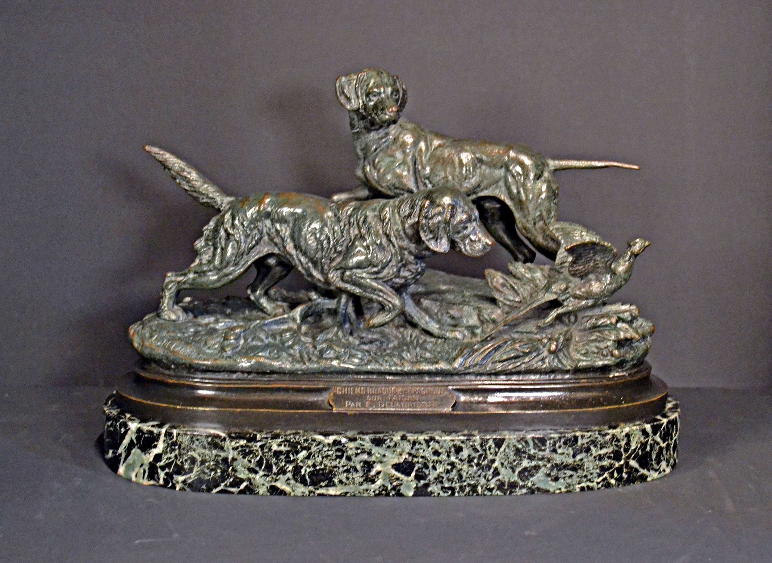 Bronze gundogs putting up a pheasant by Delabrierre