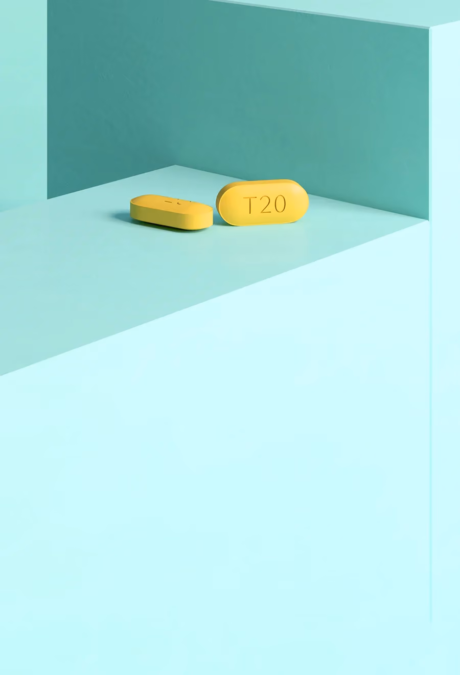 ミントグリーン色の台の上にある2錠のタダラフィル 20mg