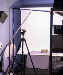 A person taking a taking a photograh in the photography suite at Plus X Innovation Brighton