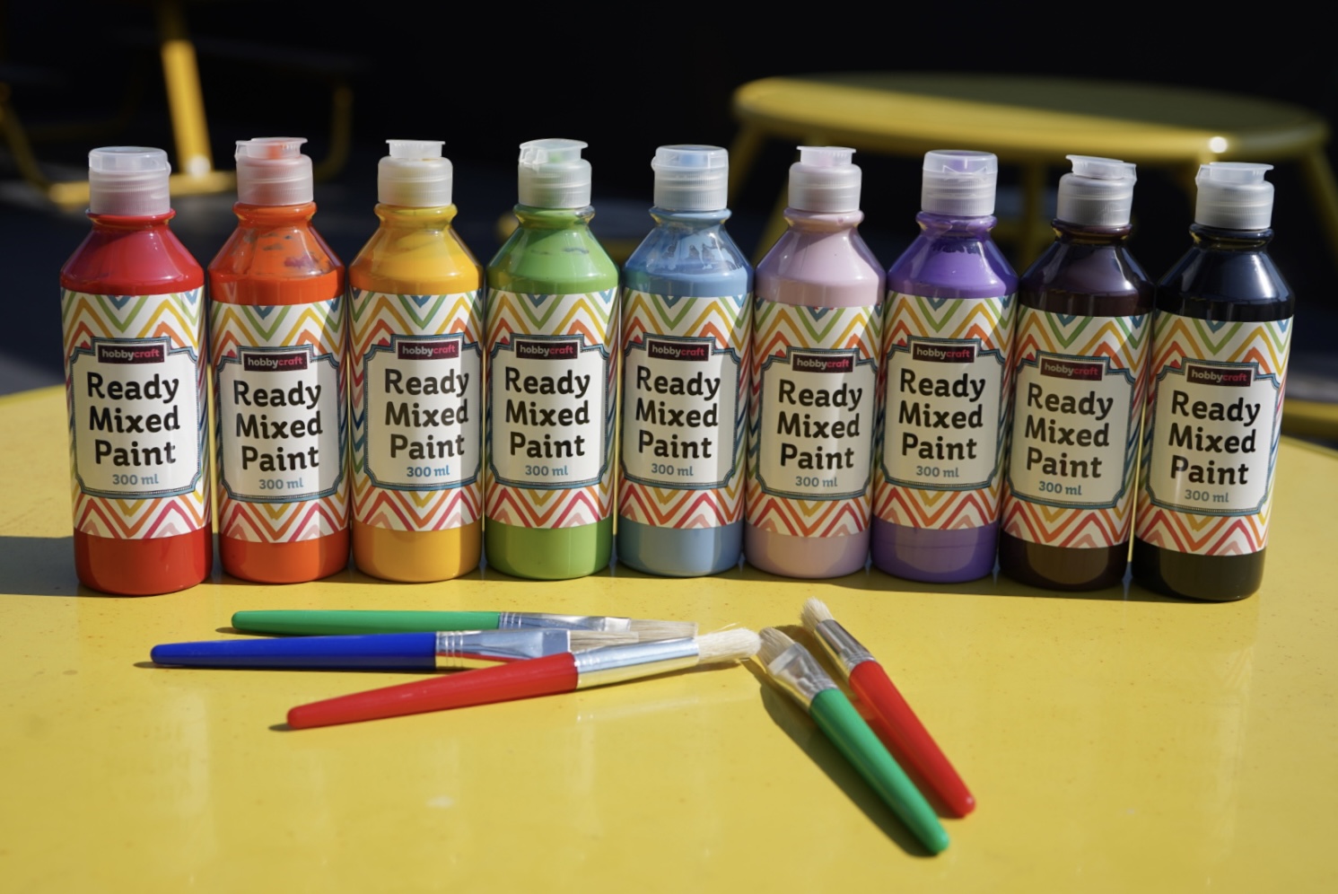 Set of vibrant paint bottles in multiple colors