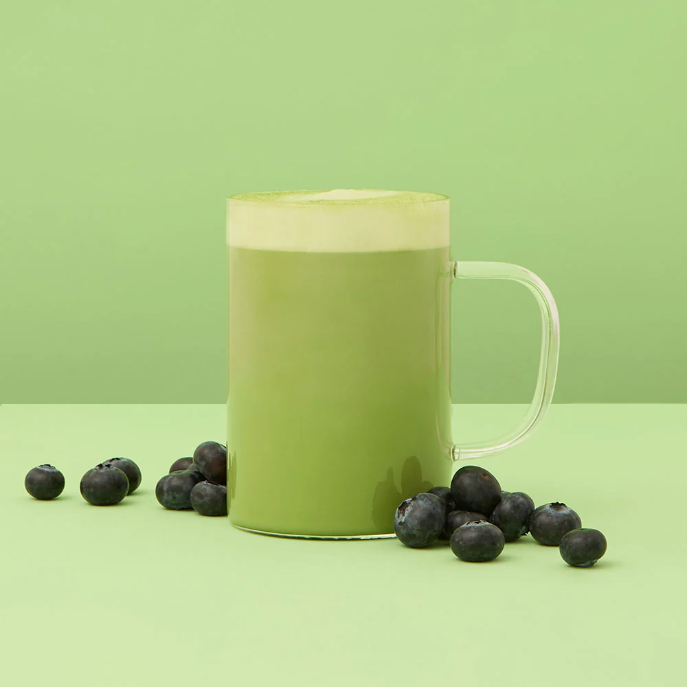 Member pouring a drink at social event in Brighton