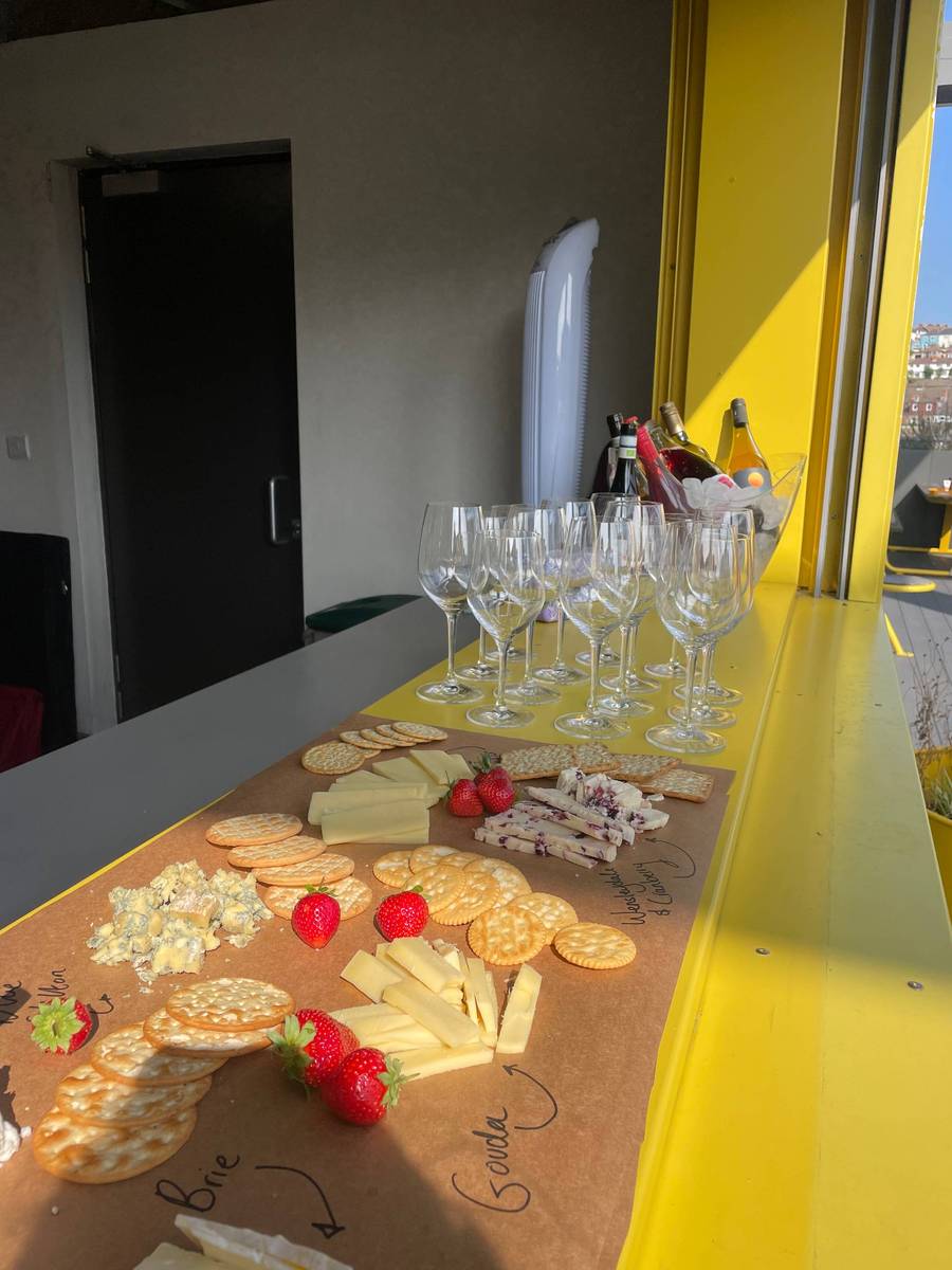 Plus X Innovation member pouring wine on the bar