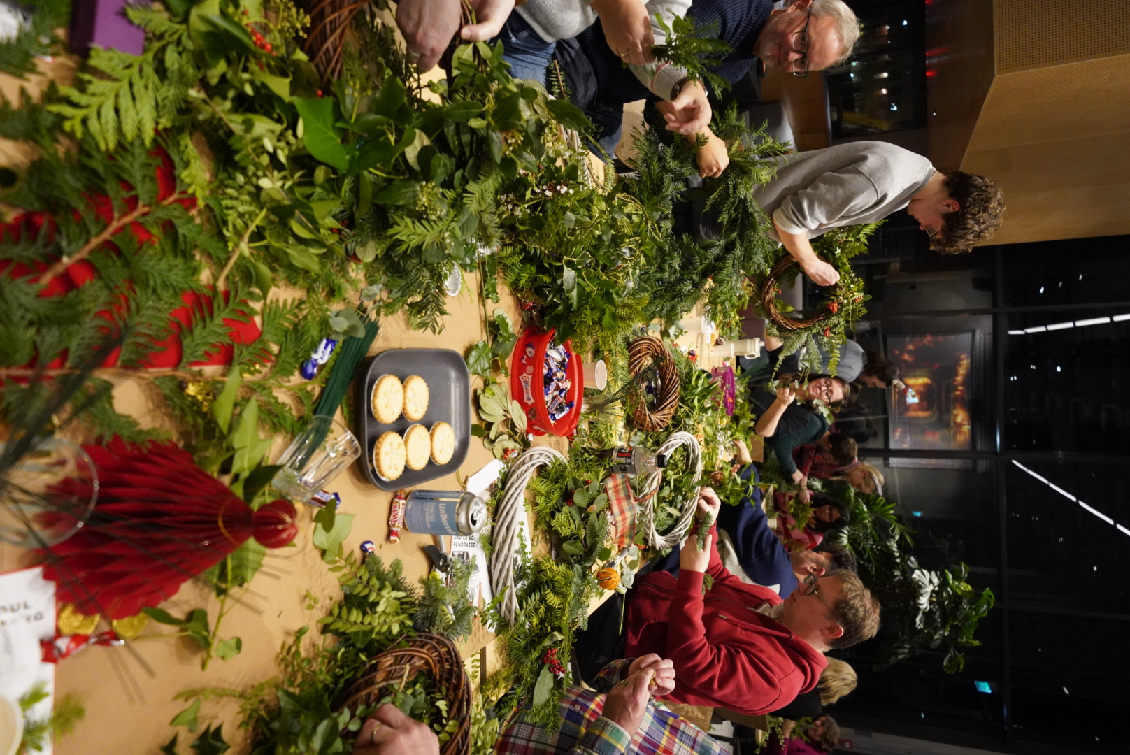 A person making a wreath