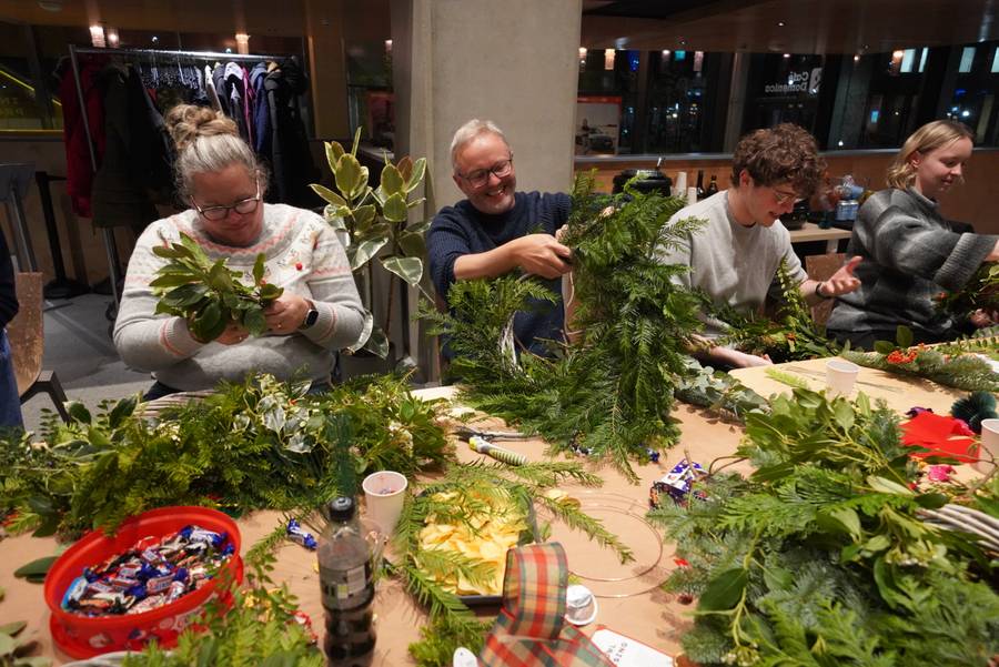 A person making a wreath