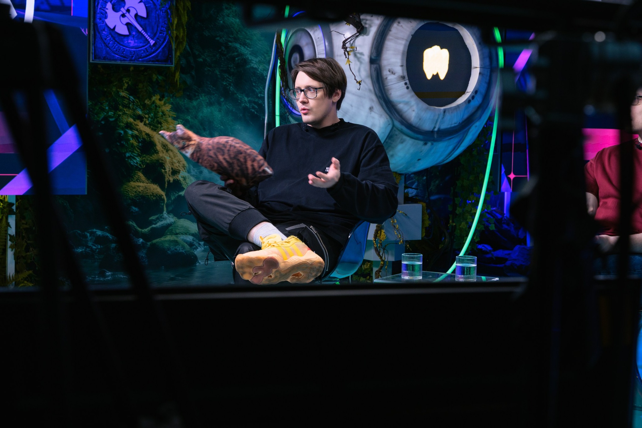 Presenter seated during a live recording in BLAST Studio