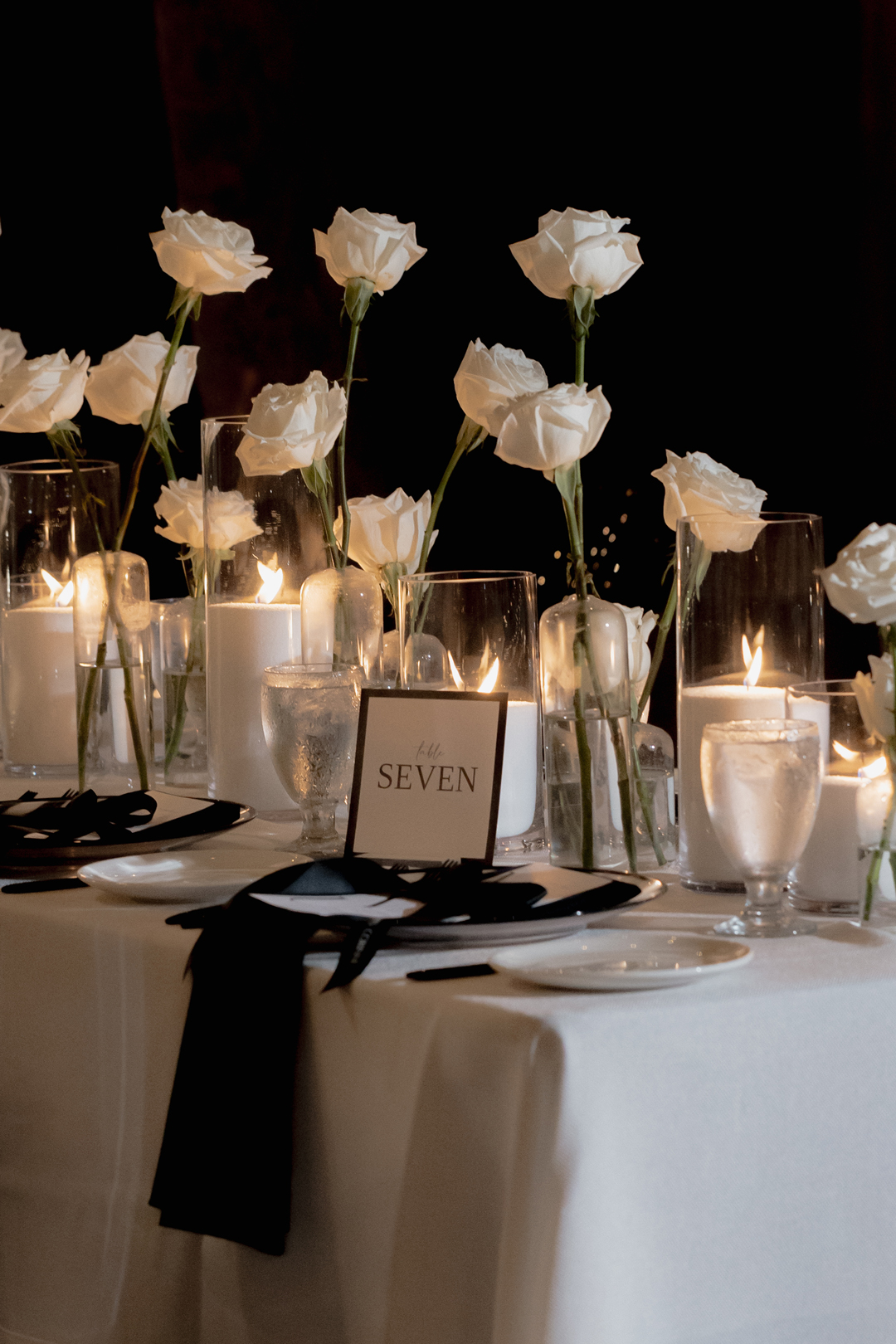 Black and white reception decor and florals.
