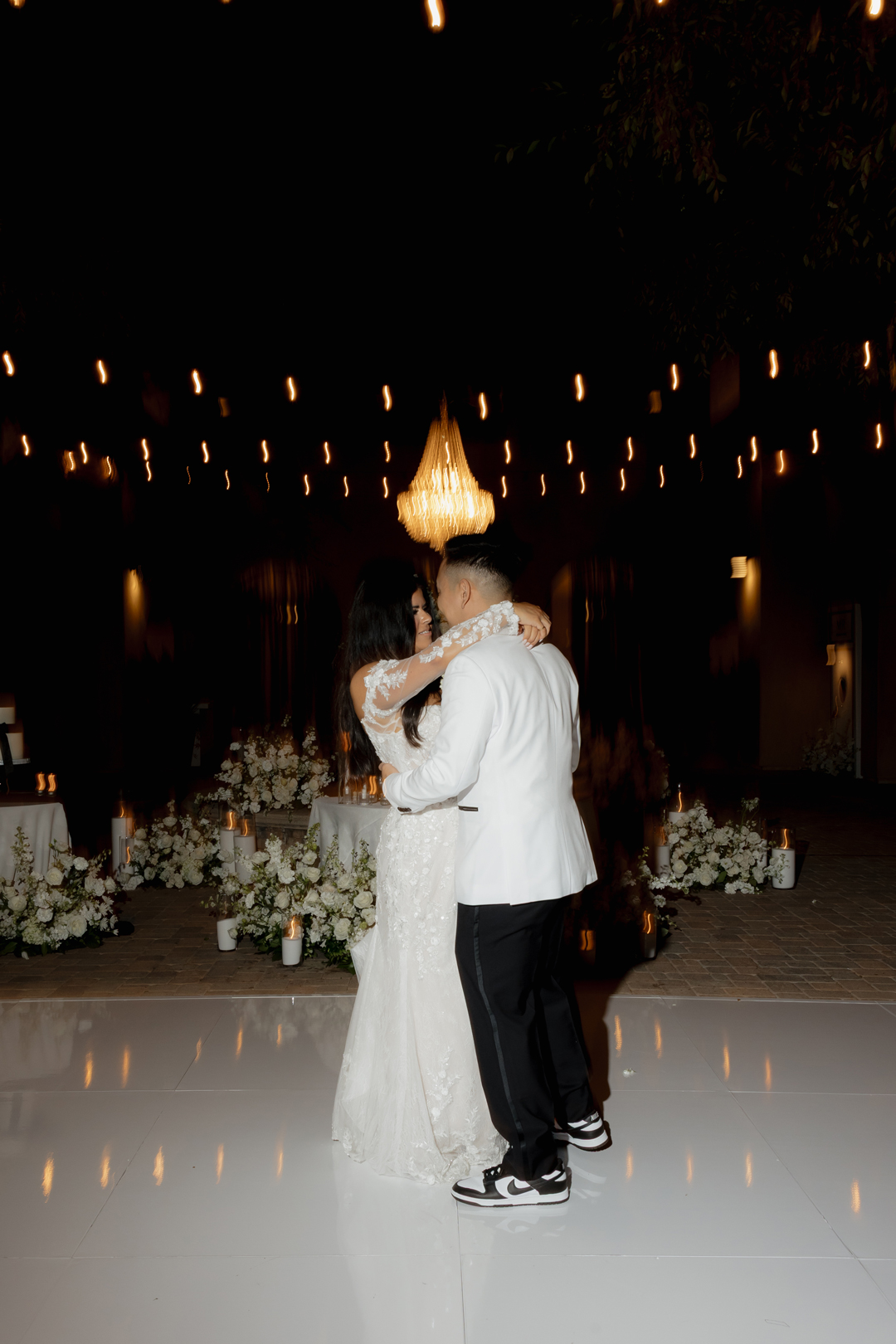 Bride and groom share their first dance.