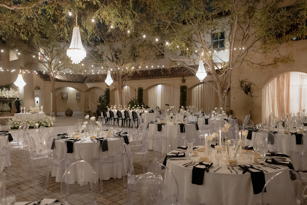 Luxury black and white outdoor courtyard wedding reception in San Juan Capistrano.