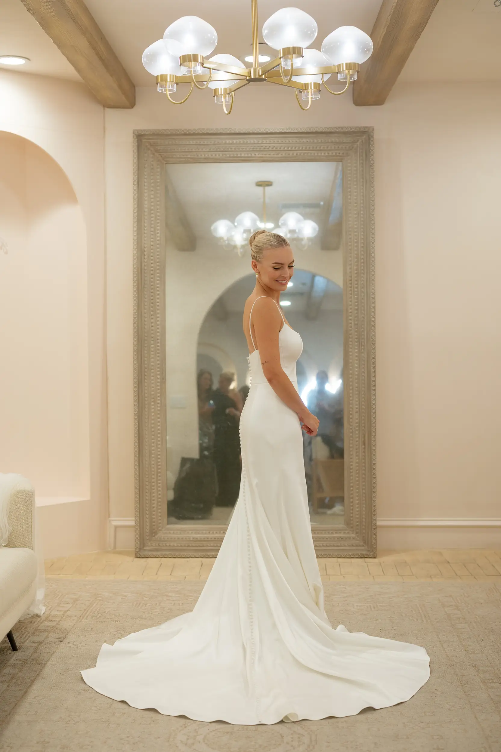 Bride standing in wedding dress inside Serra Plaza's modern bridal suite.