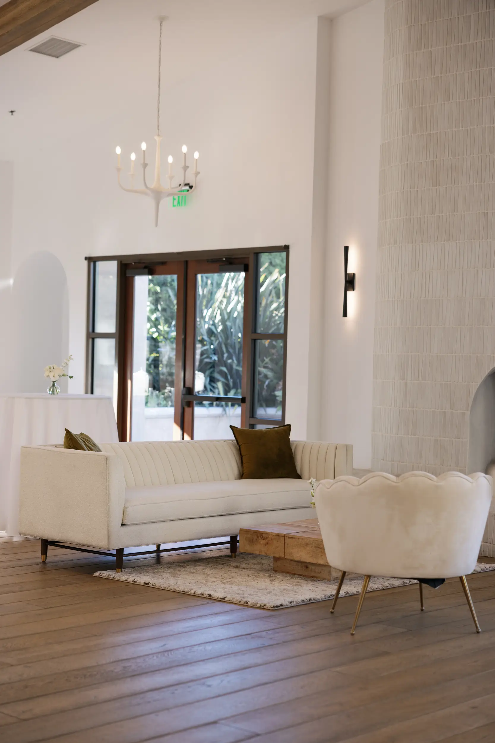 Modern, neutral wedding lounge inside Serra Plaza for cocktail hour.