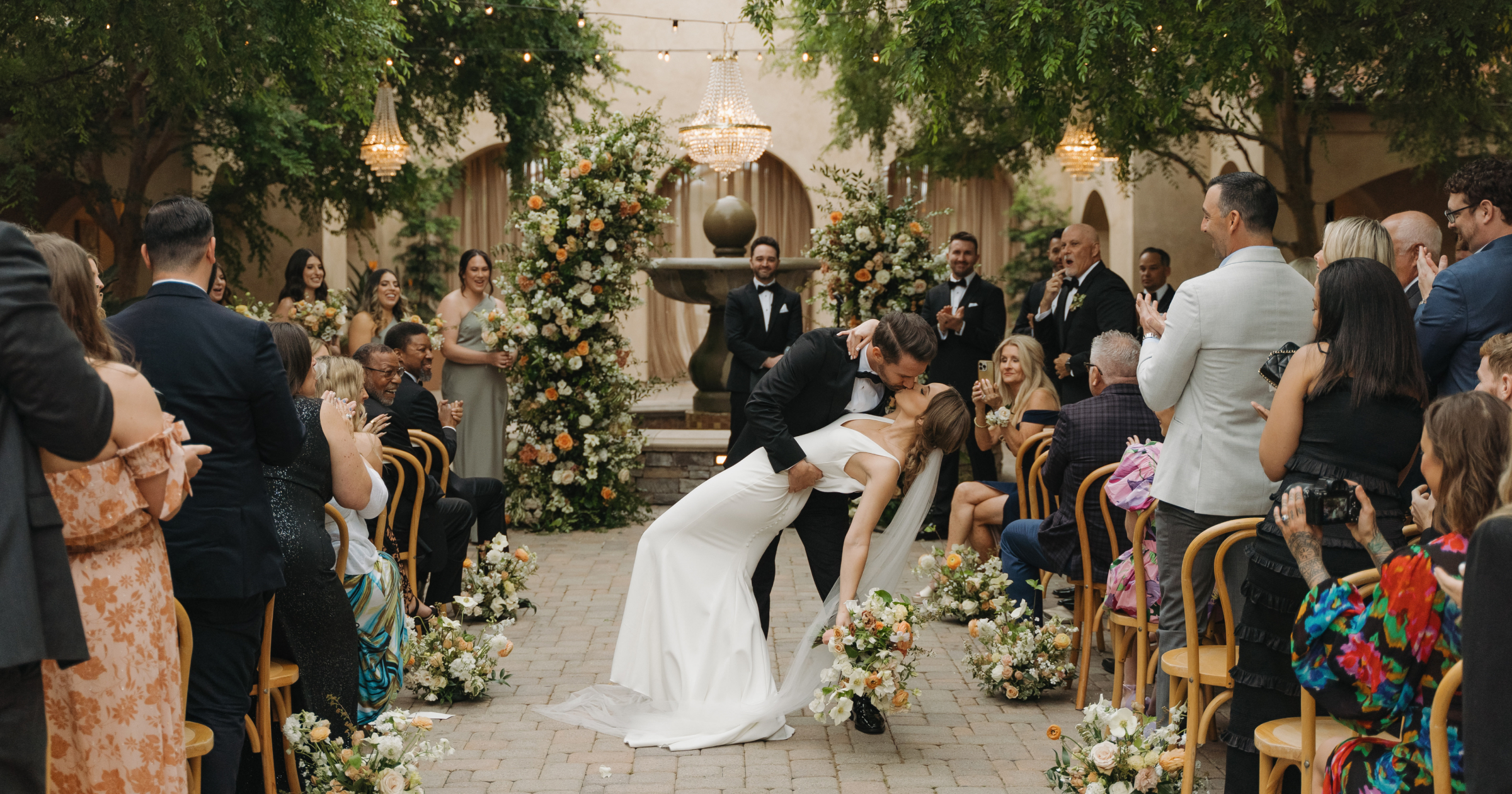 Courtyard reception under market lights at Serra Plaza