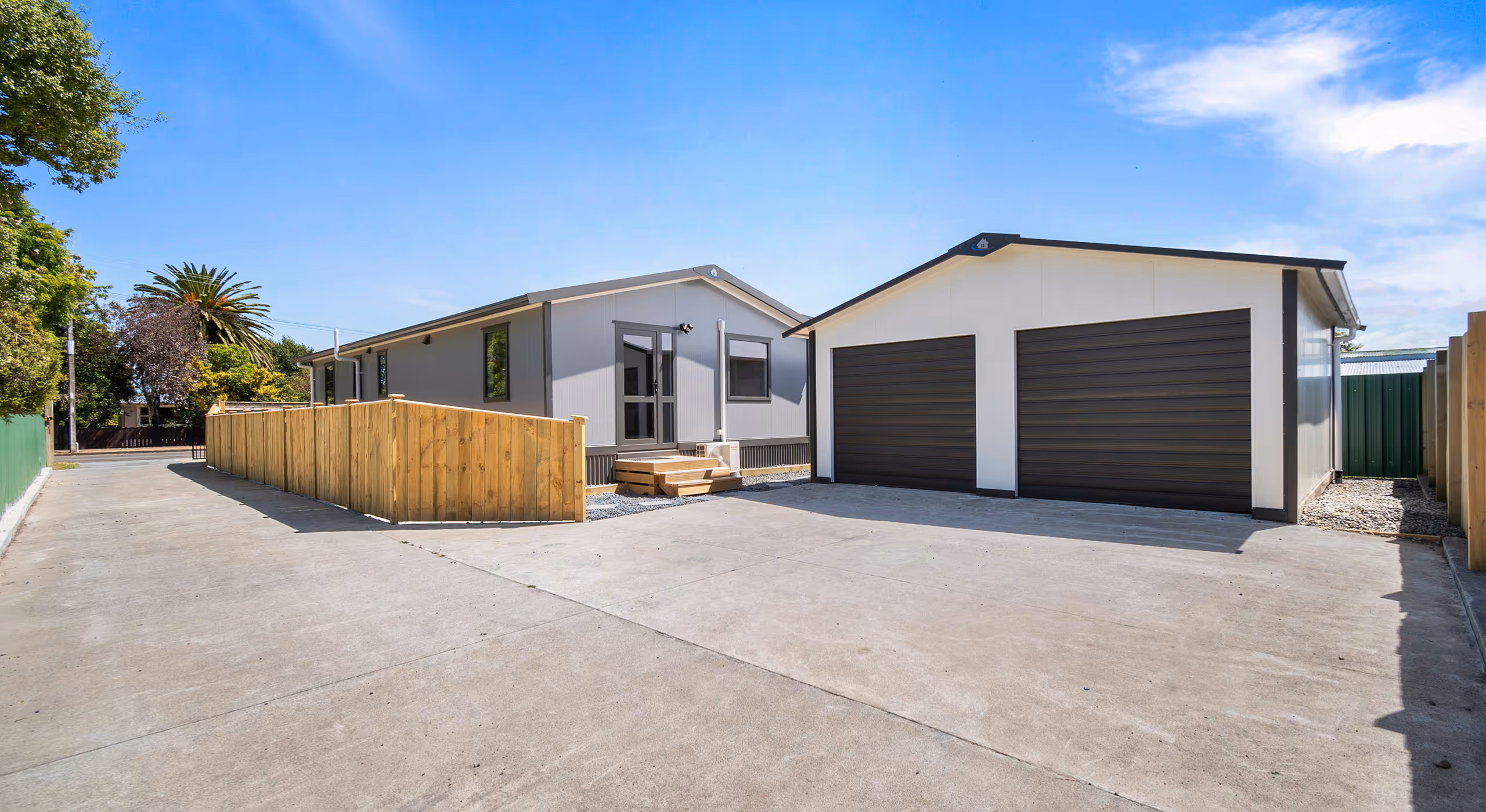 A finished Quick Build Homes 3 bedroom it set home with fencing, decking and garaging. Choose to build yourself or do the Quick Build full build package