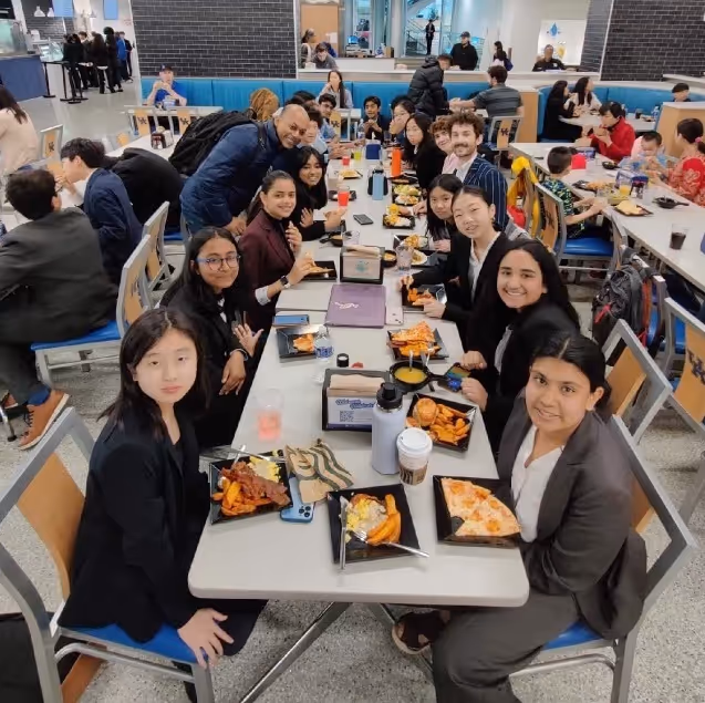 Bergen Debate students eating a meal during a tournament.
