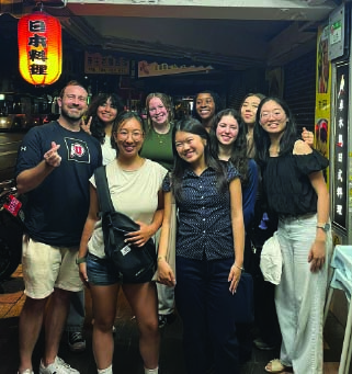 Group of AIP interns enjoying an evening out together in an Asian city.