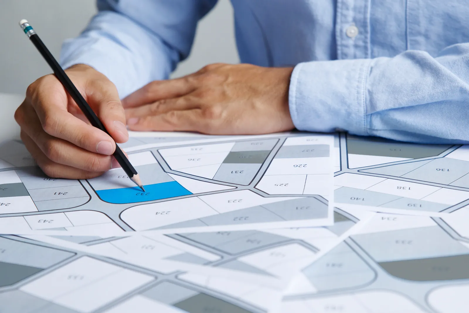 Planner marking a lot on a subdivision plan