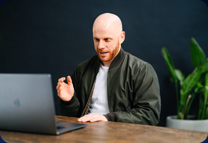 Rob reviewing a member's work on his laptop