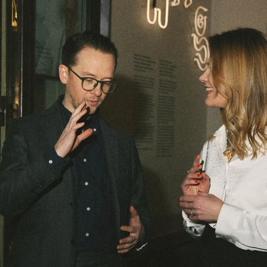 Jessica Rameau having a conversations with a man