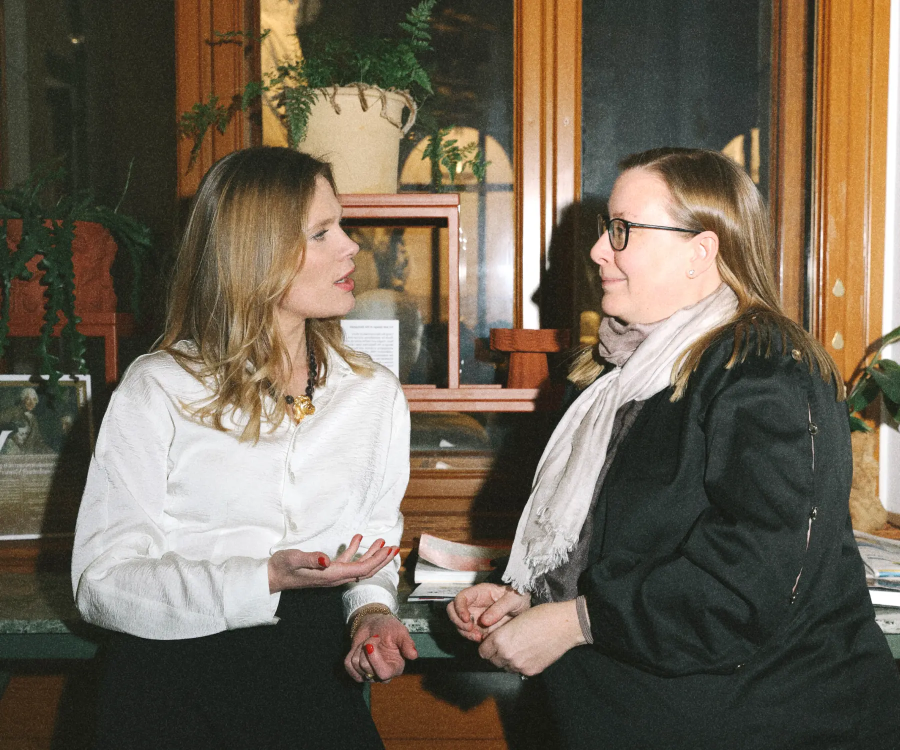 Jessica Rameau having a conversation with a woman