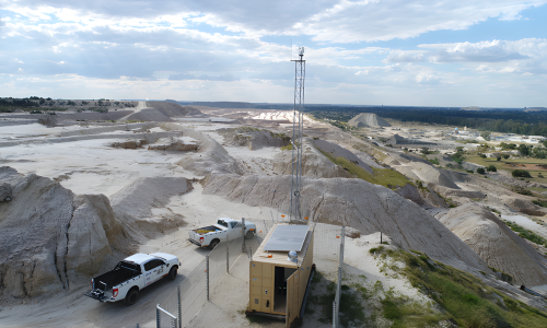 A photo of a mine site and Secu vehicles