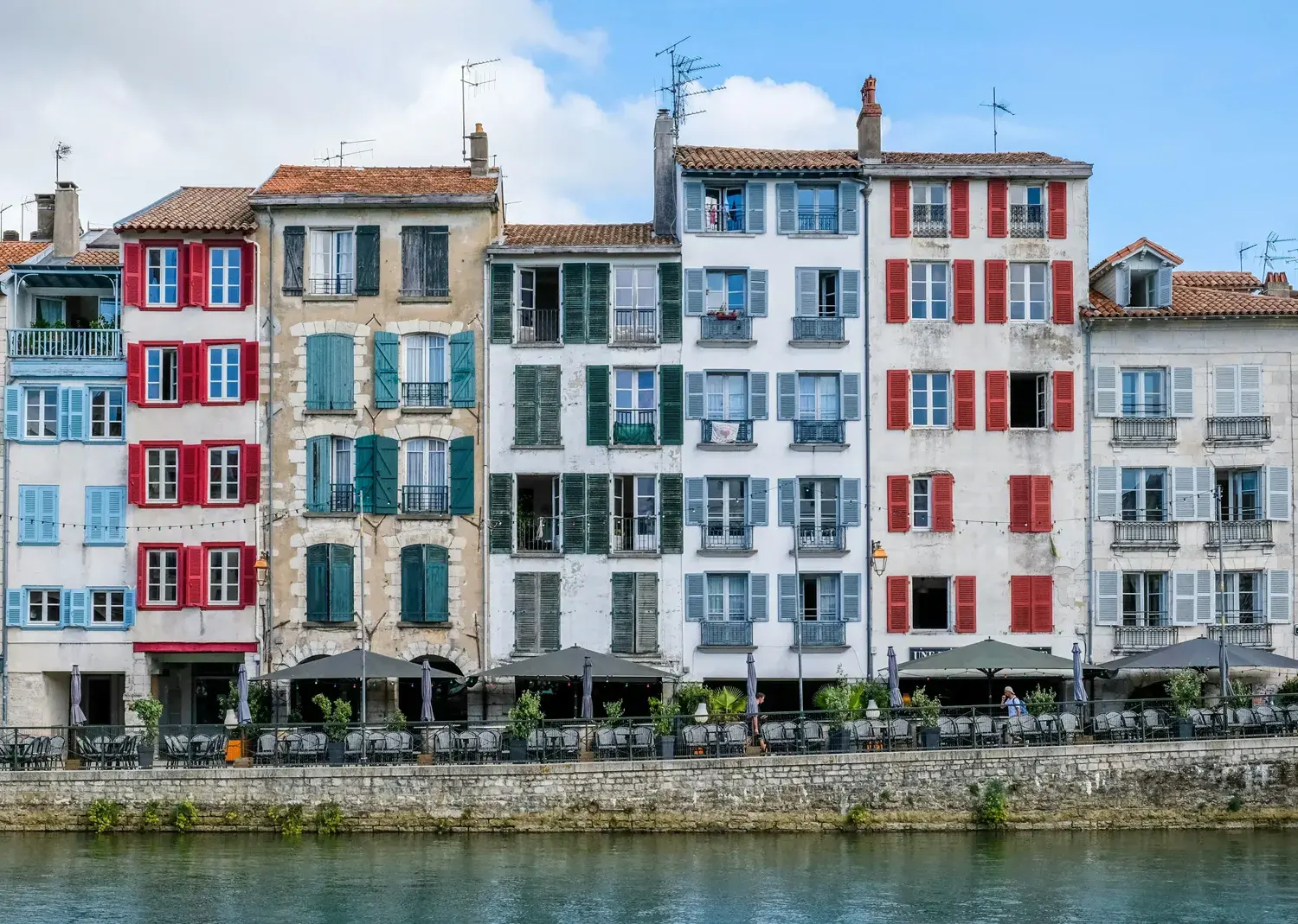 Colorful houses along the Nive River in Bayonne, Basque Country, France