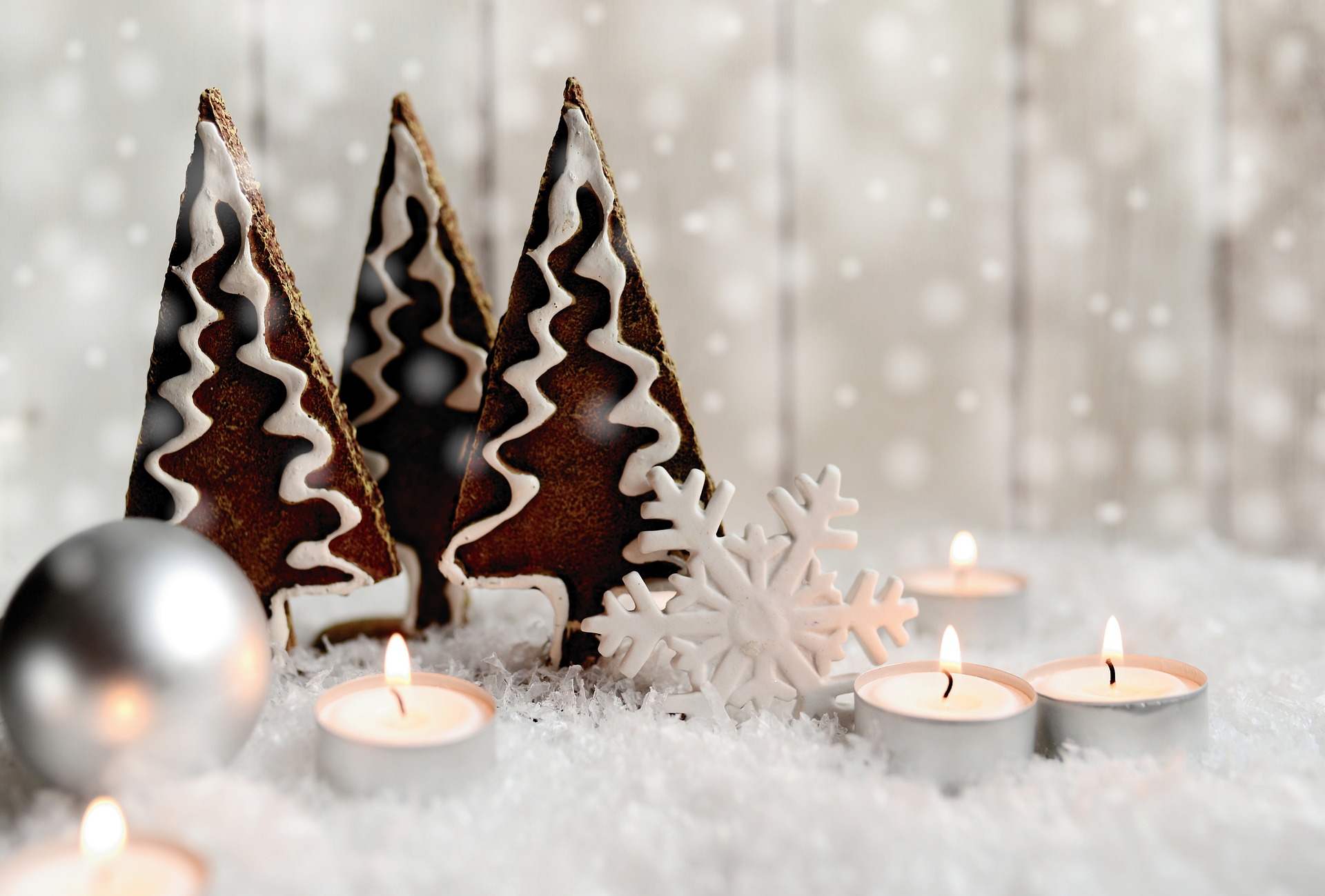 Christmas decorations with tea lights and fir tree figures