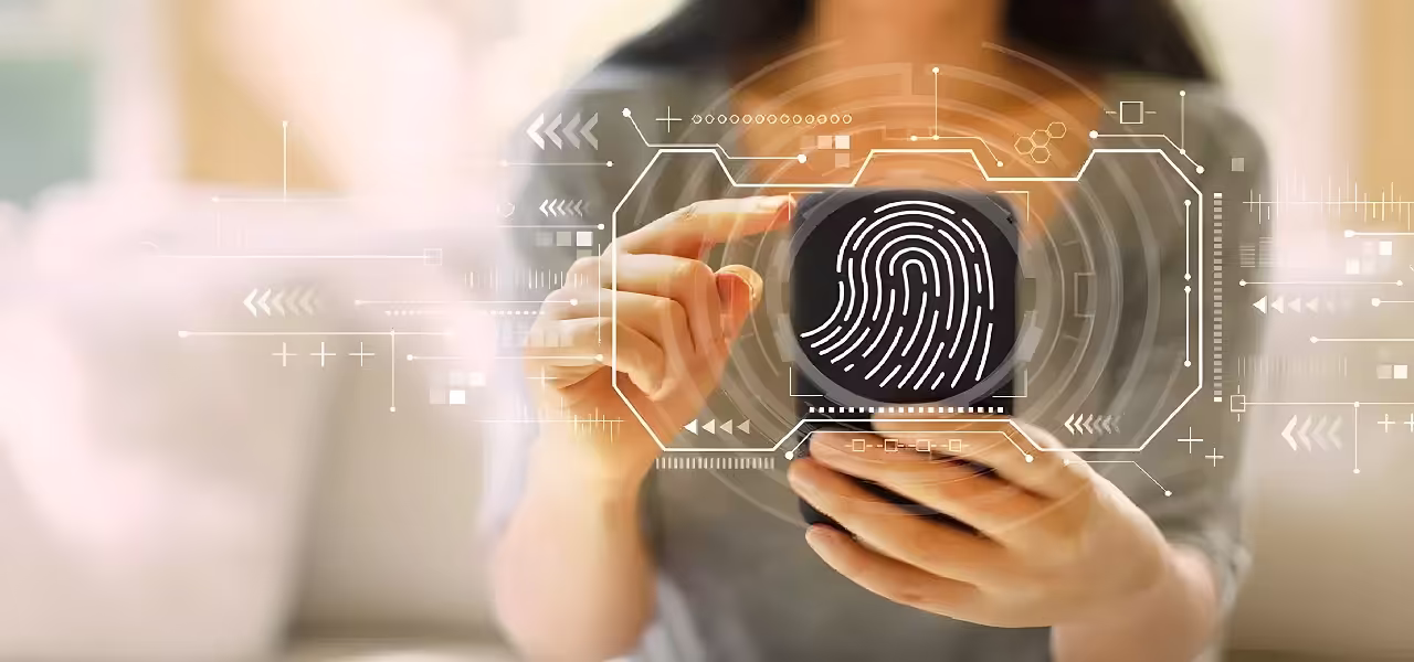 Person using a cell phone with fingerprint on a technological background to represent secure telematic voting.