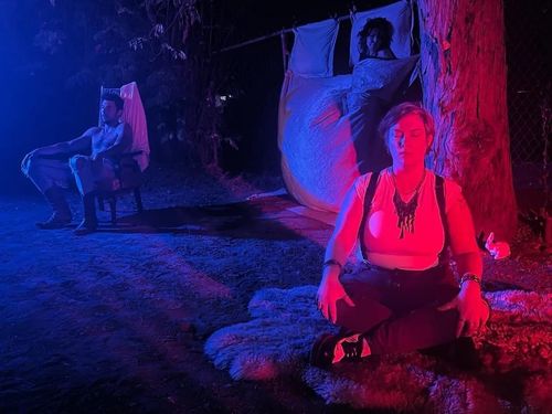 Red Slum Goddess V next to tree