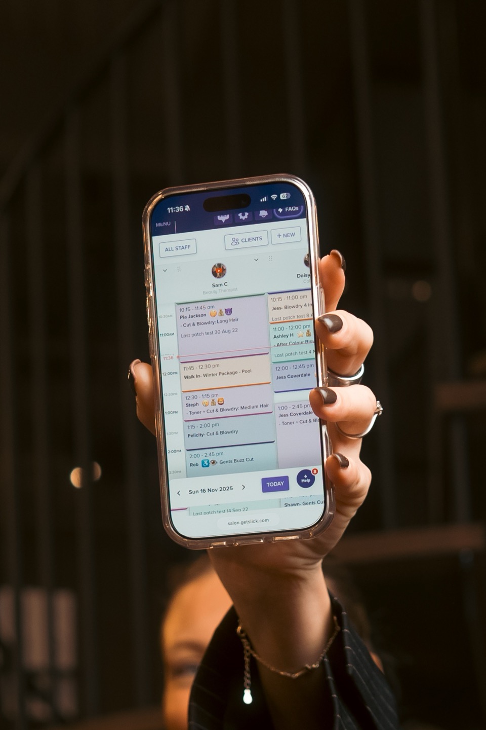 Slick salon booking app shown on a smartphone
