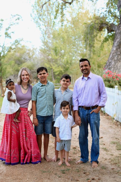 A family who adopted children through IAN