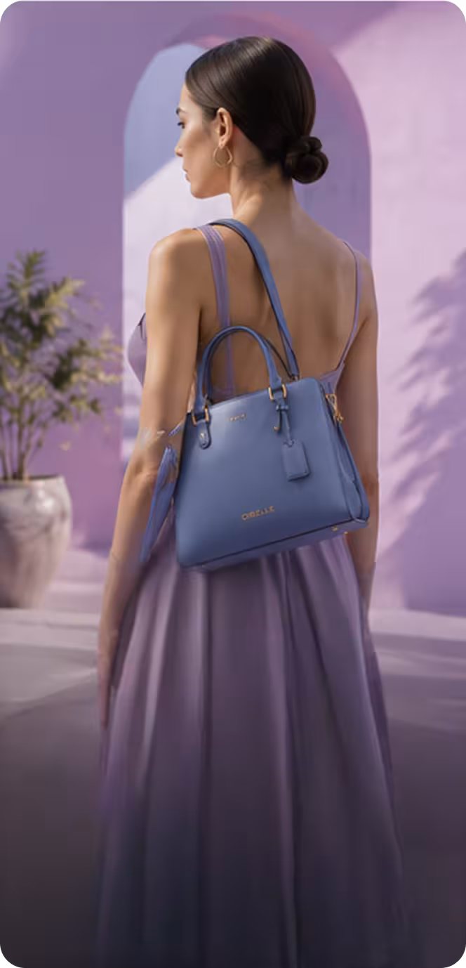 Woman in a sleeveless lavender dress carrying a blue handbag over her shoulder in a purple arched setting.