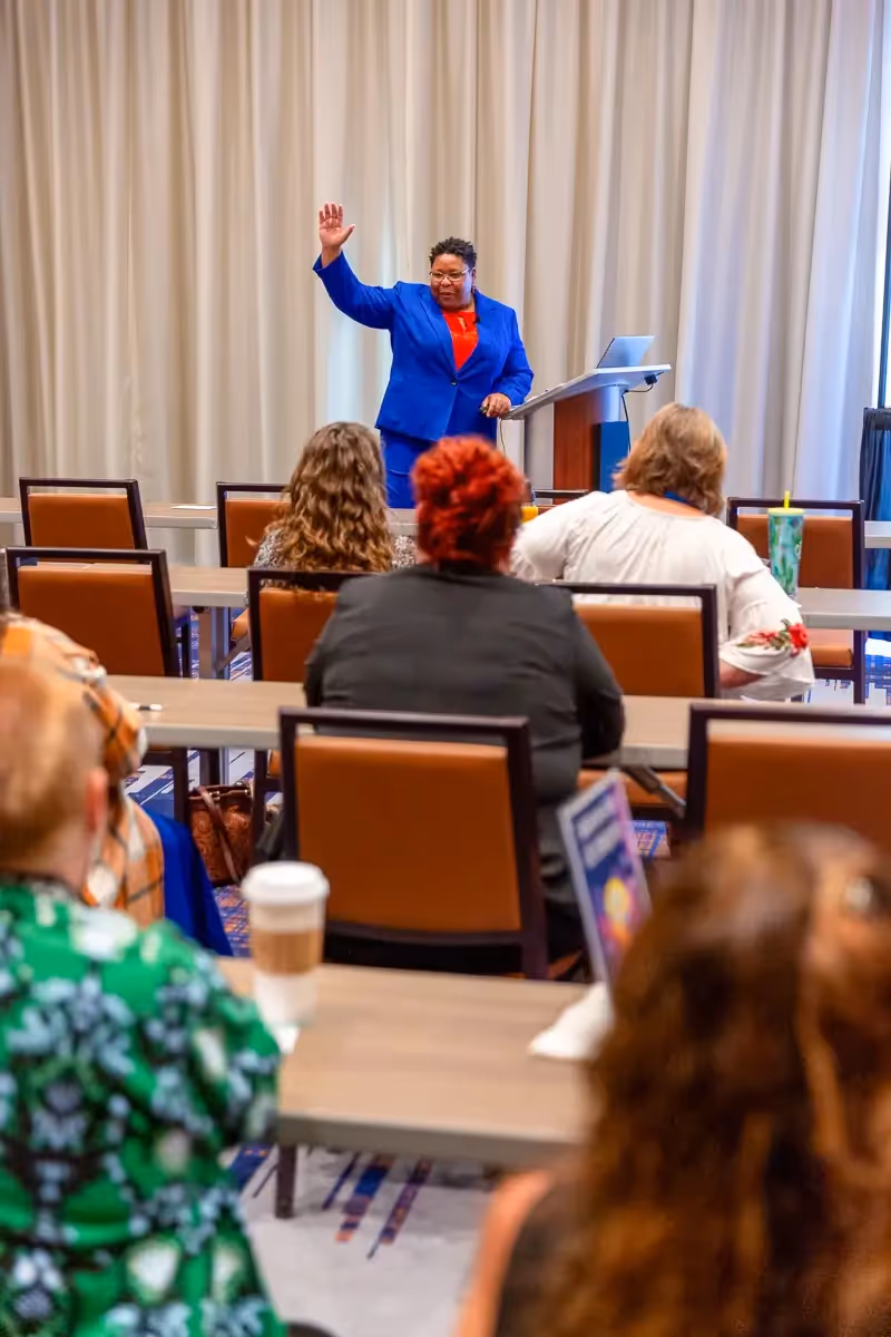 Burnout Coach Dr Brandy Biglow speaking at Integrative Health conference