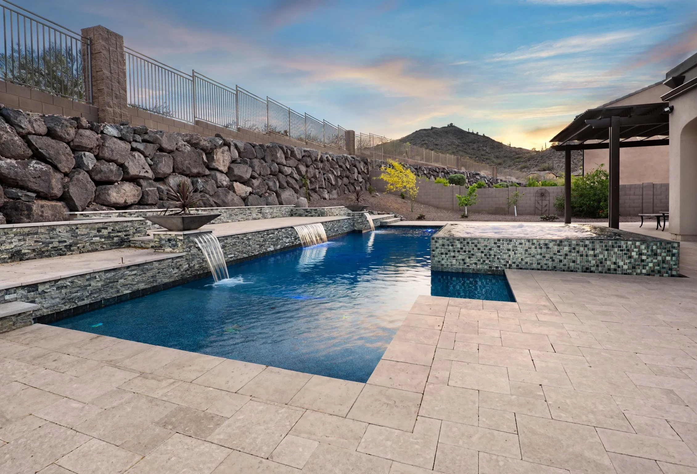Custom pool with waterfall scuppers