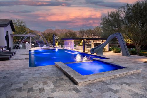 Custom pool and spa with water jet features and waterslide