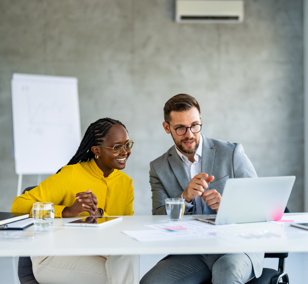 Man and woman reviewing work at the Altis Ottawa office.