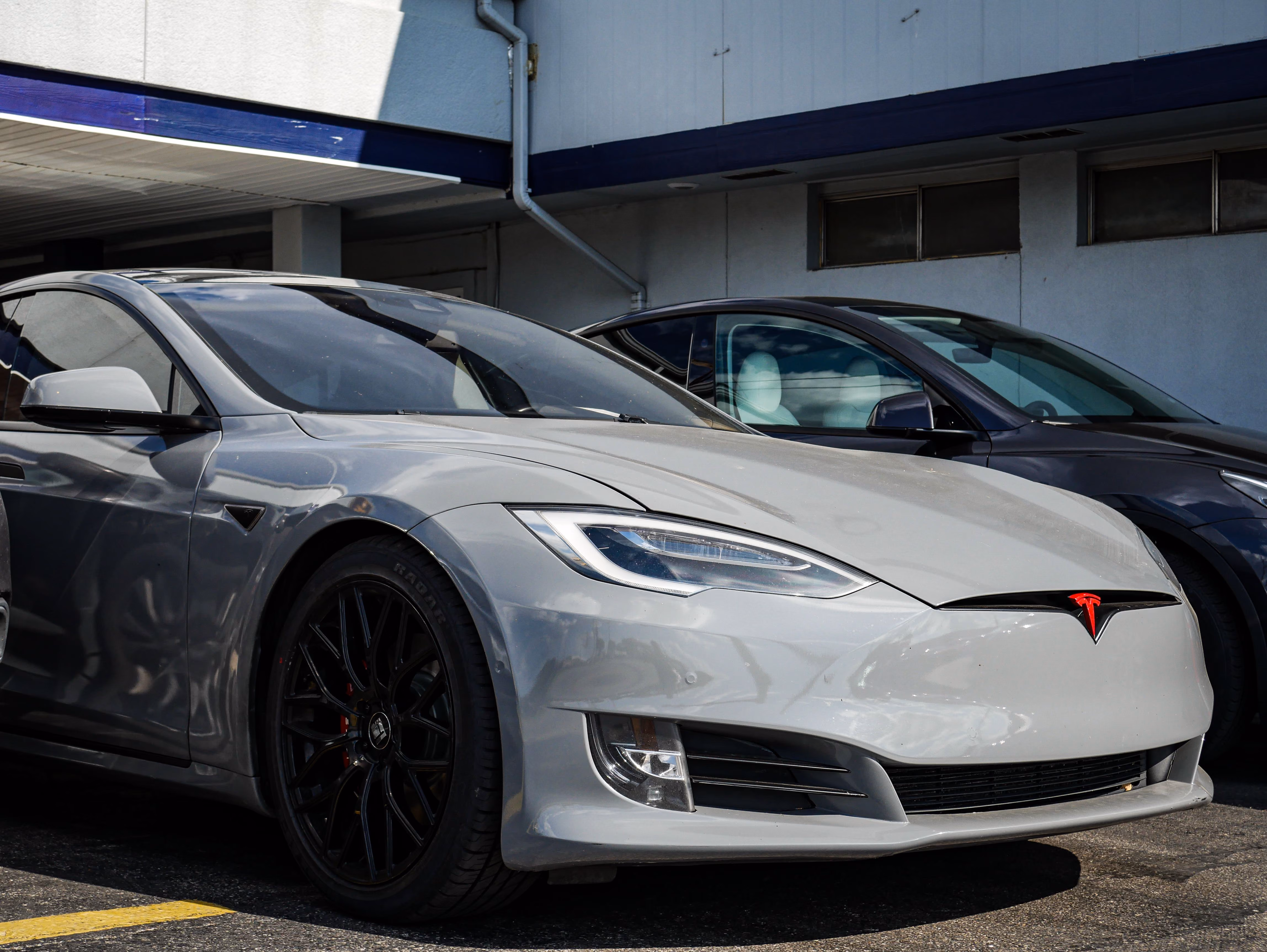 Tesla Model S front detail with Tesla badge, serviced by United Auto Service