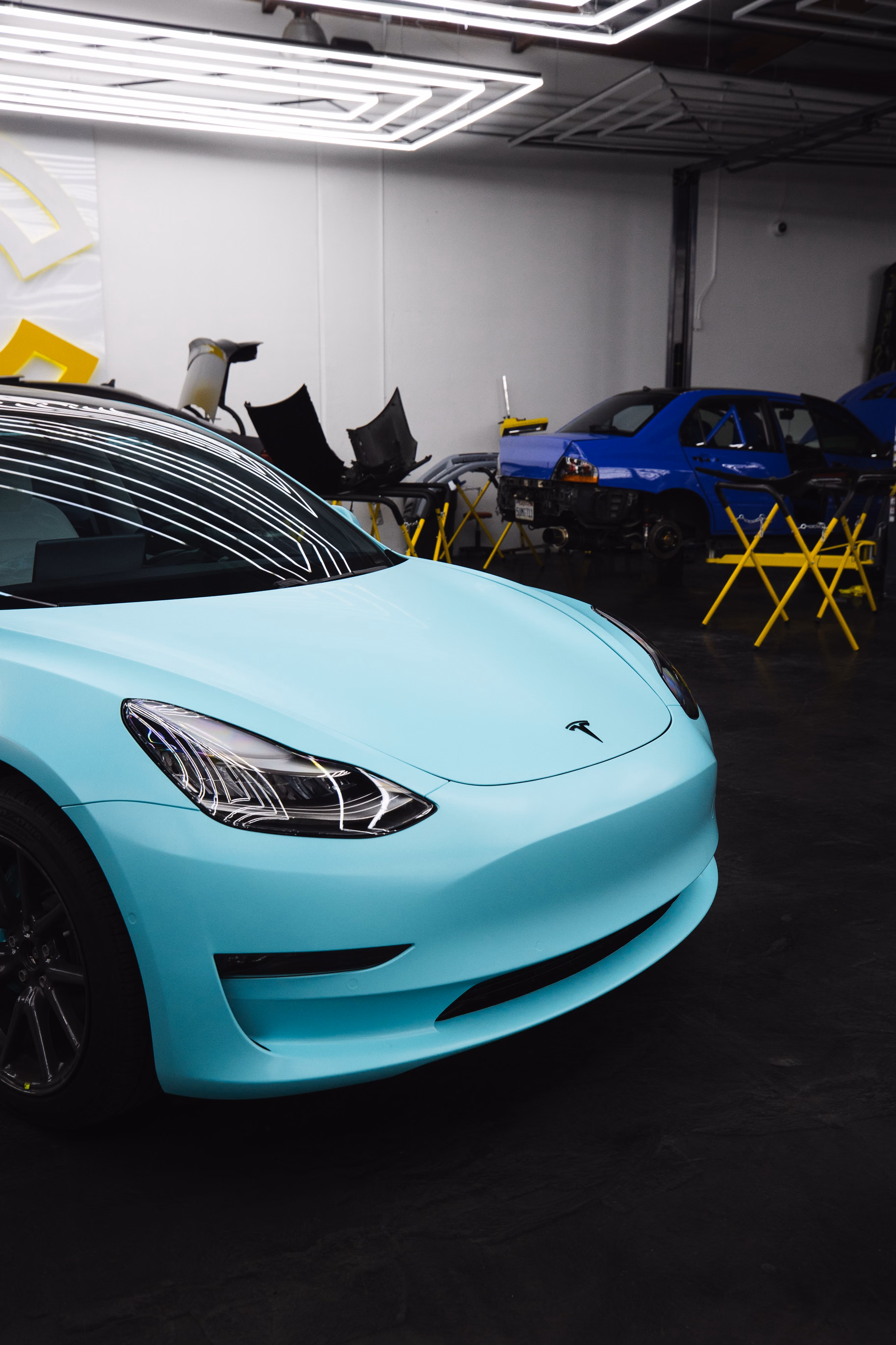 Tesla Model 3 in service bay at United Auto Service