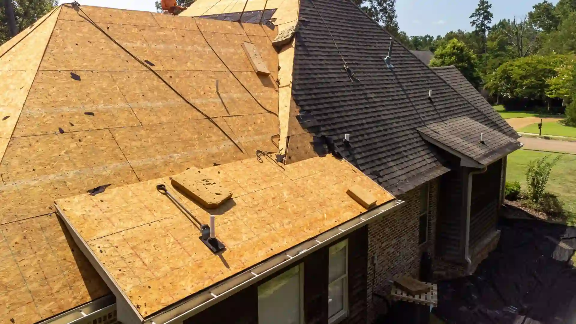 A view of a half done roof deck, with the sheathing still visible