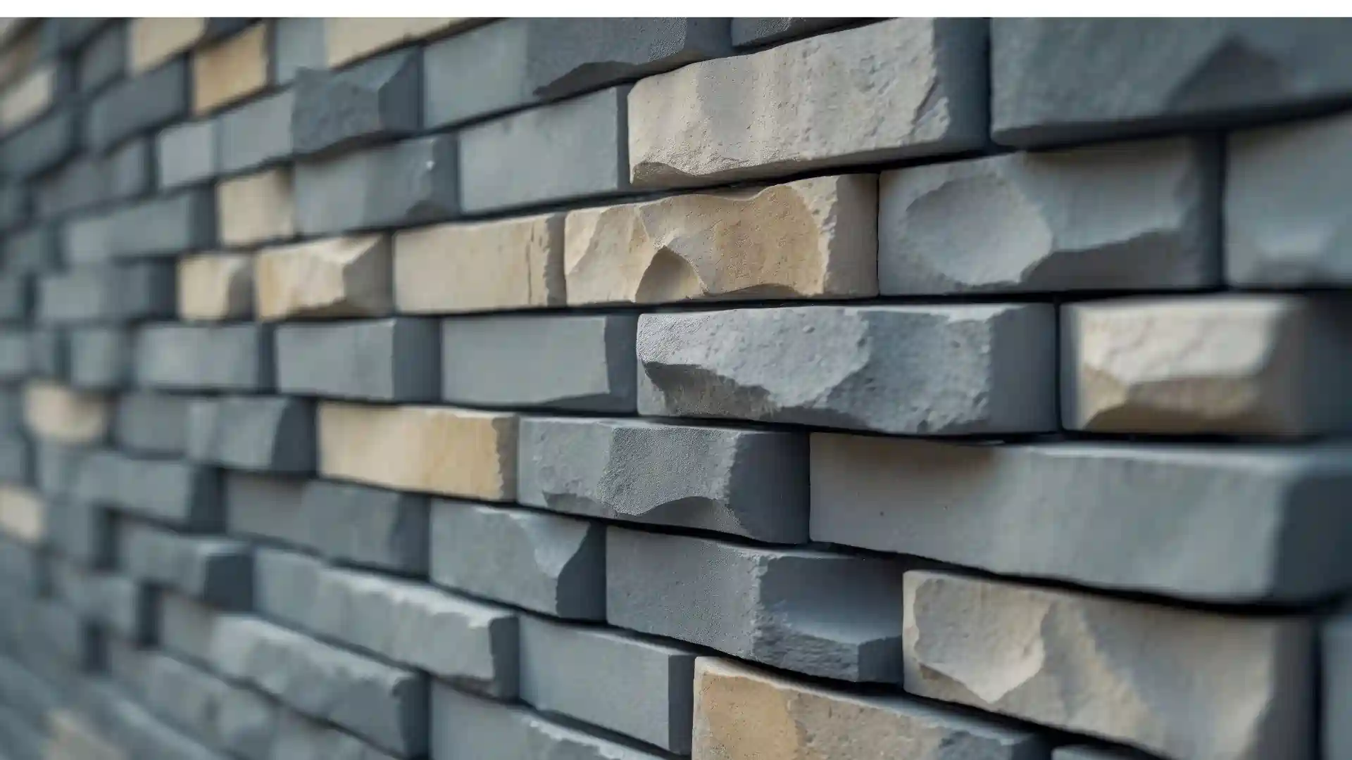 A side view of a stone veneer siding wall